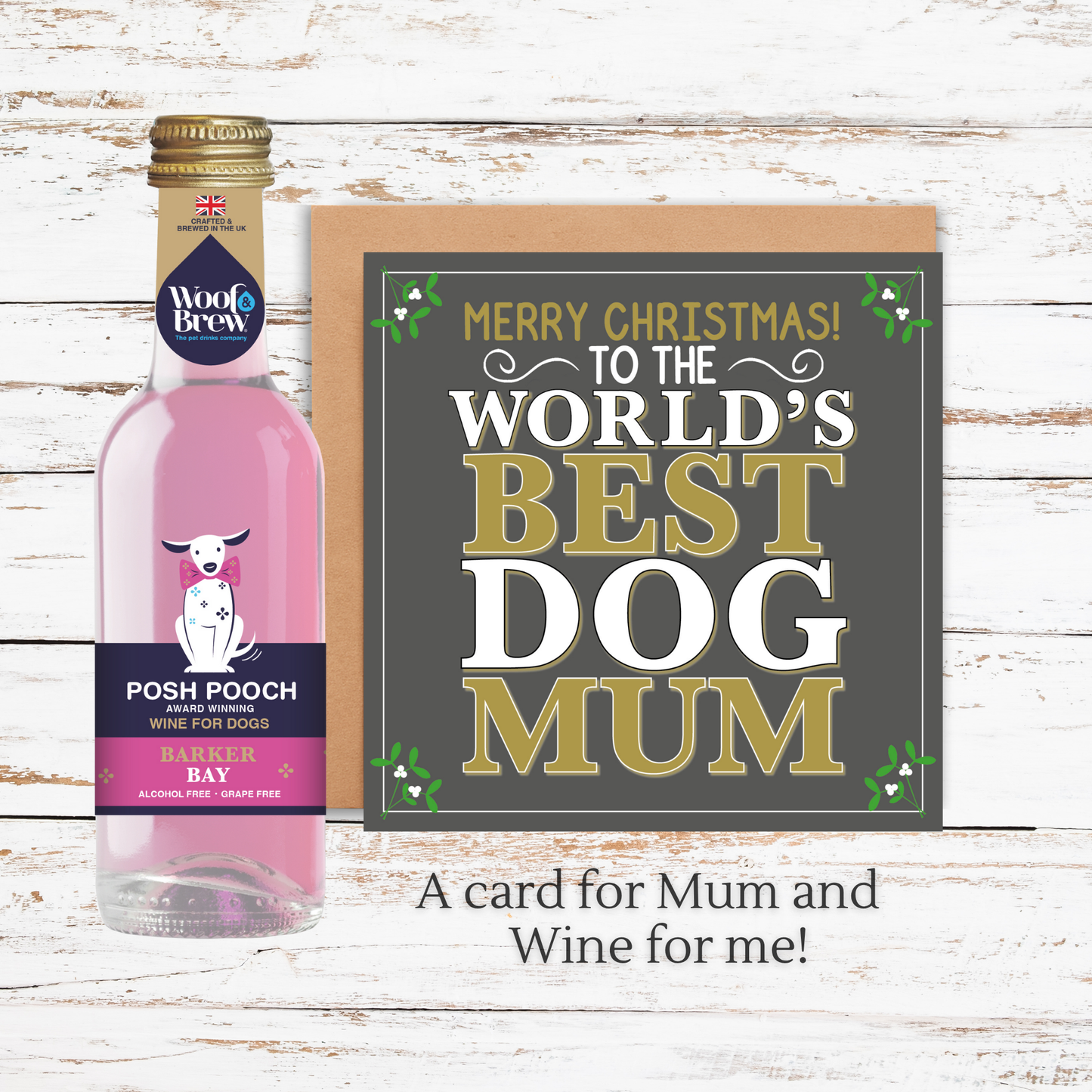 Bottle of Posh Pooch wine with a Christmas card on a wooden surface