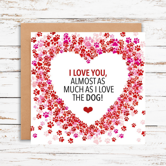 Card with paw print heart design and text on a wooden surface