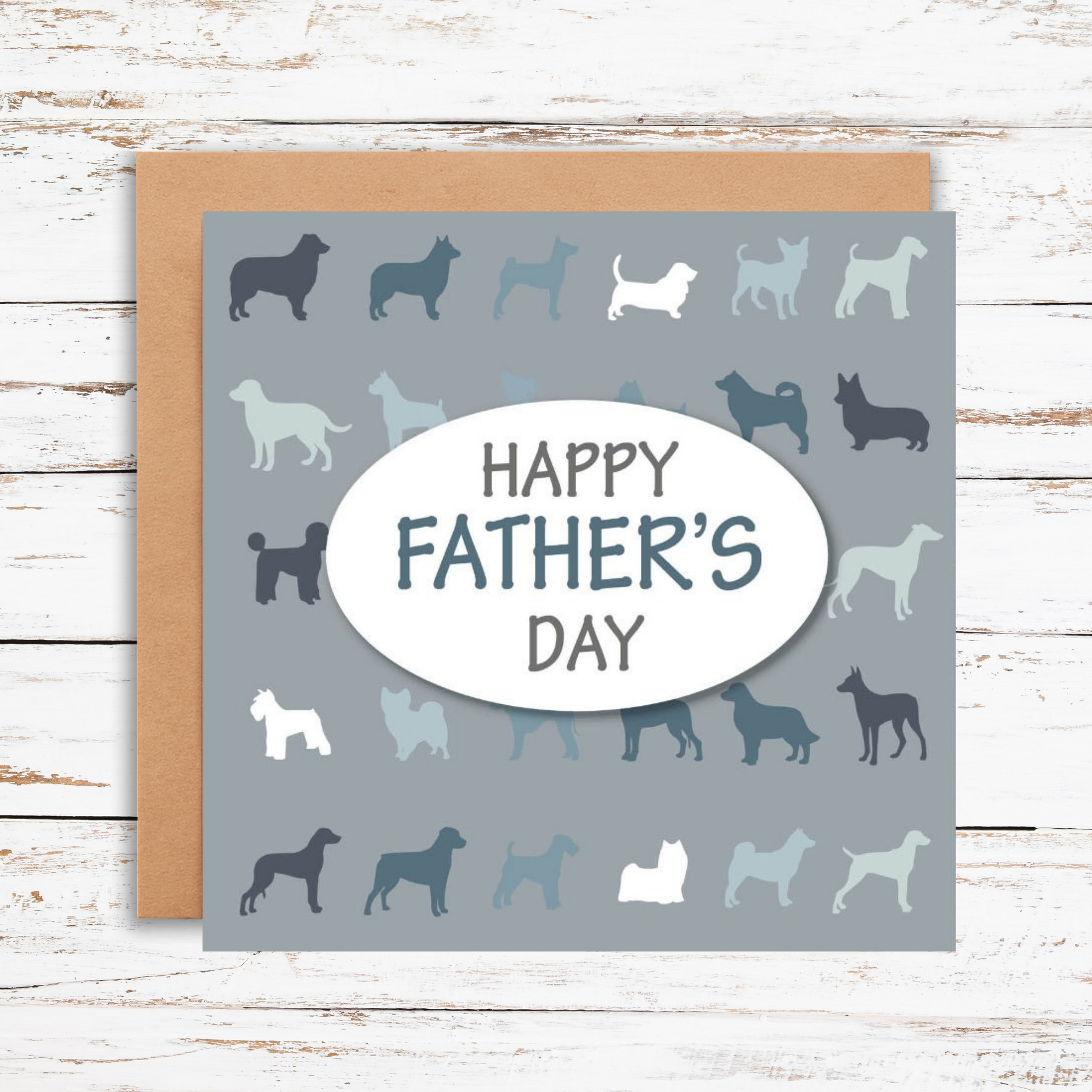 Father's Day card with dog silhouettes and 'Happy Father's Day' text on a wooden surface.