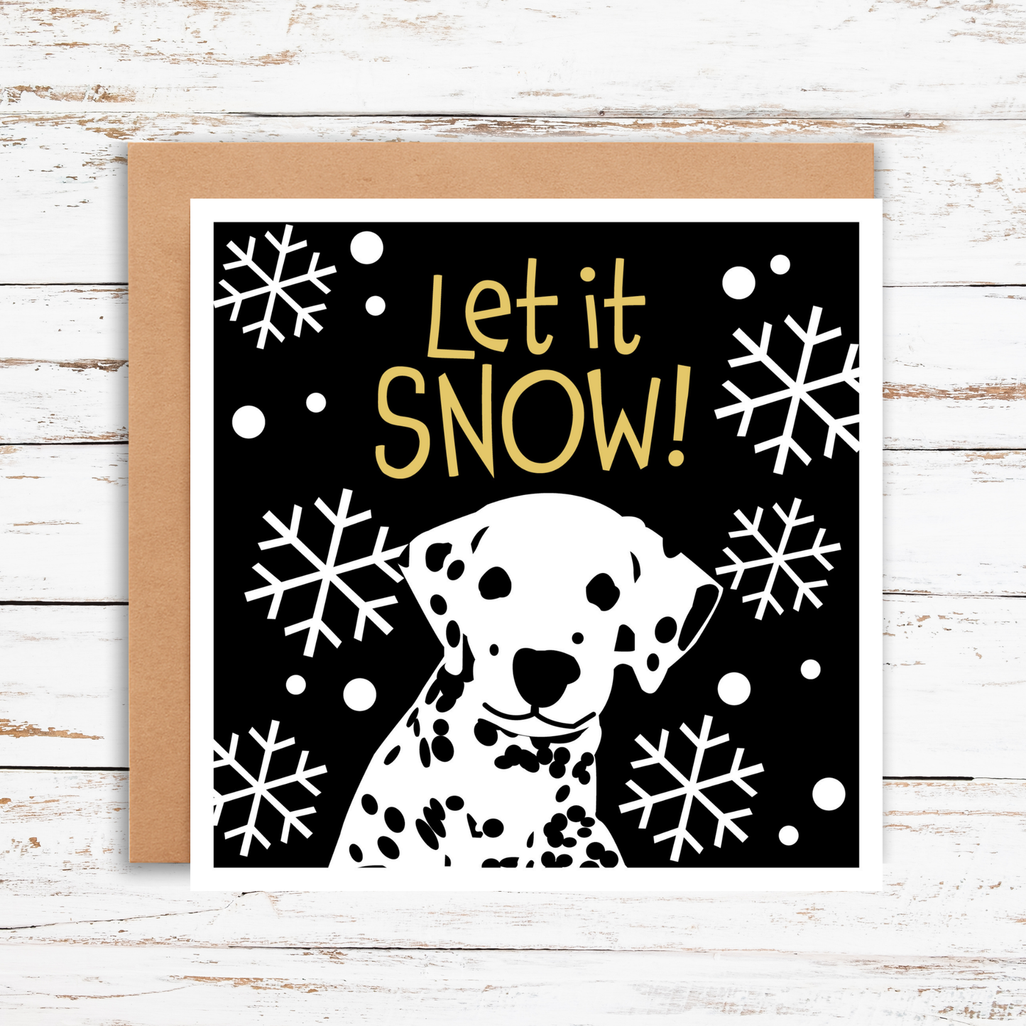 Greeting card with a Dalmatian dog illustration and 'Let it Snow!' text on a black background with snowflakes.