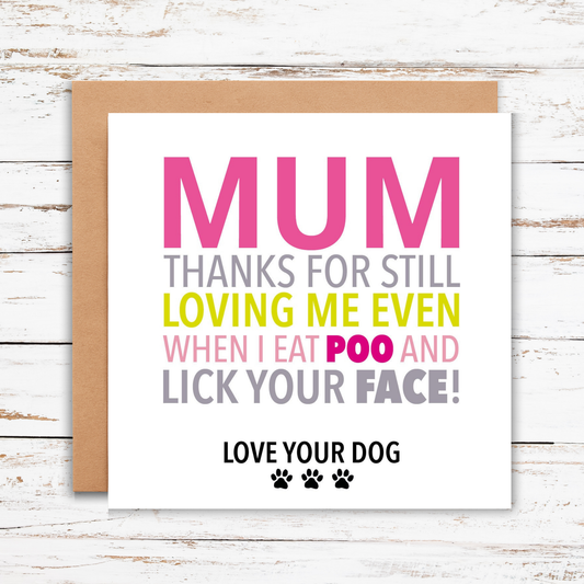 Card with humorous message to a dog owner on a wooden surface