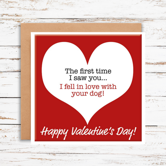 Valentine's Day card with a red heart and humorous text on a wooden surface