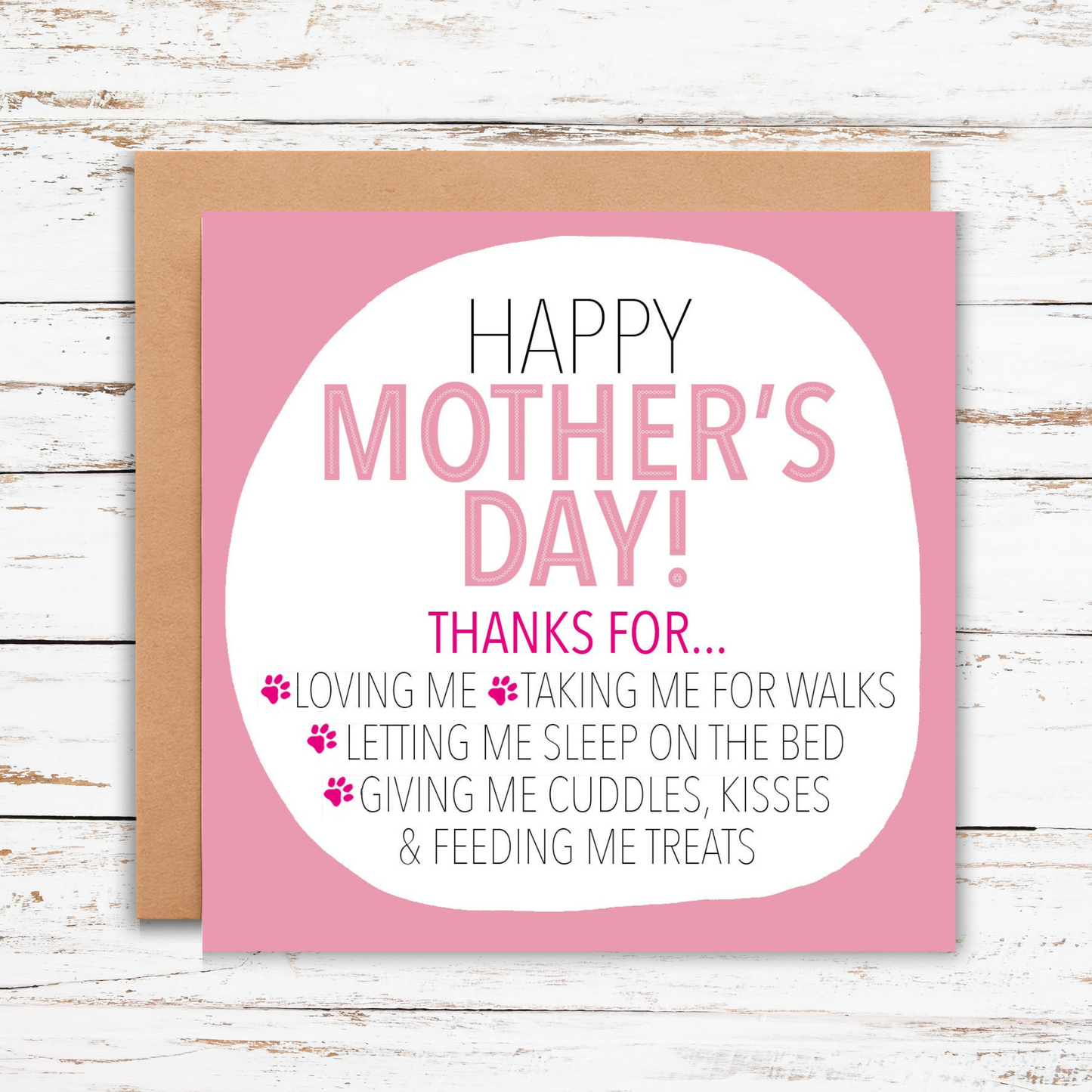 Mother's Day card with pink border and white text on a wooden surface