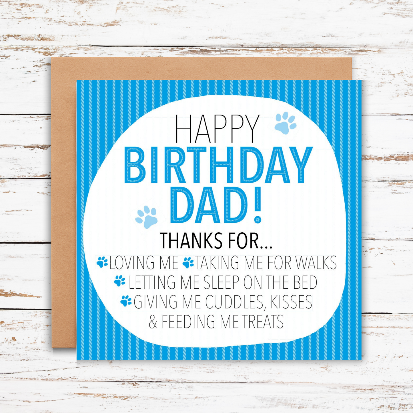 Birthday card for a dad with blue text and paw prints on a wooden background