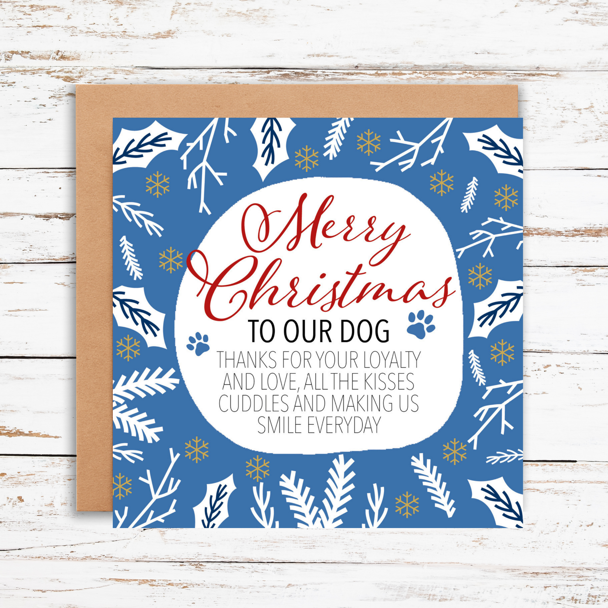 Christmas card for dogs with blue and white design on a wooden surface