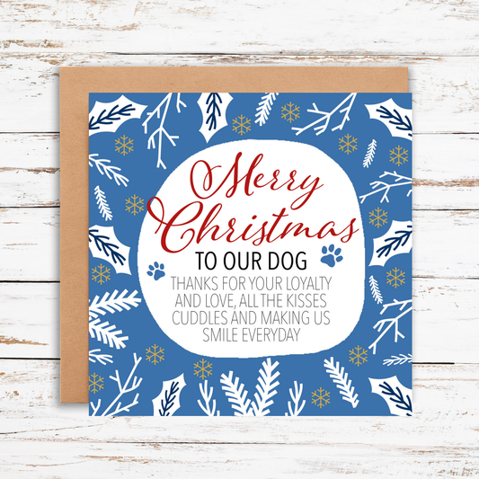 Christmas card for dogs with blue and white design on a wooden surface