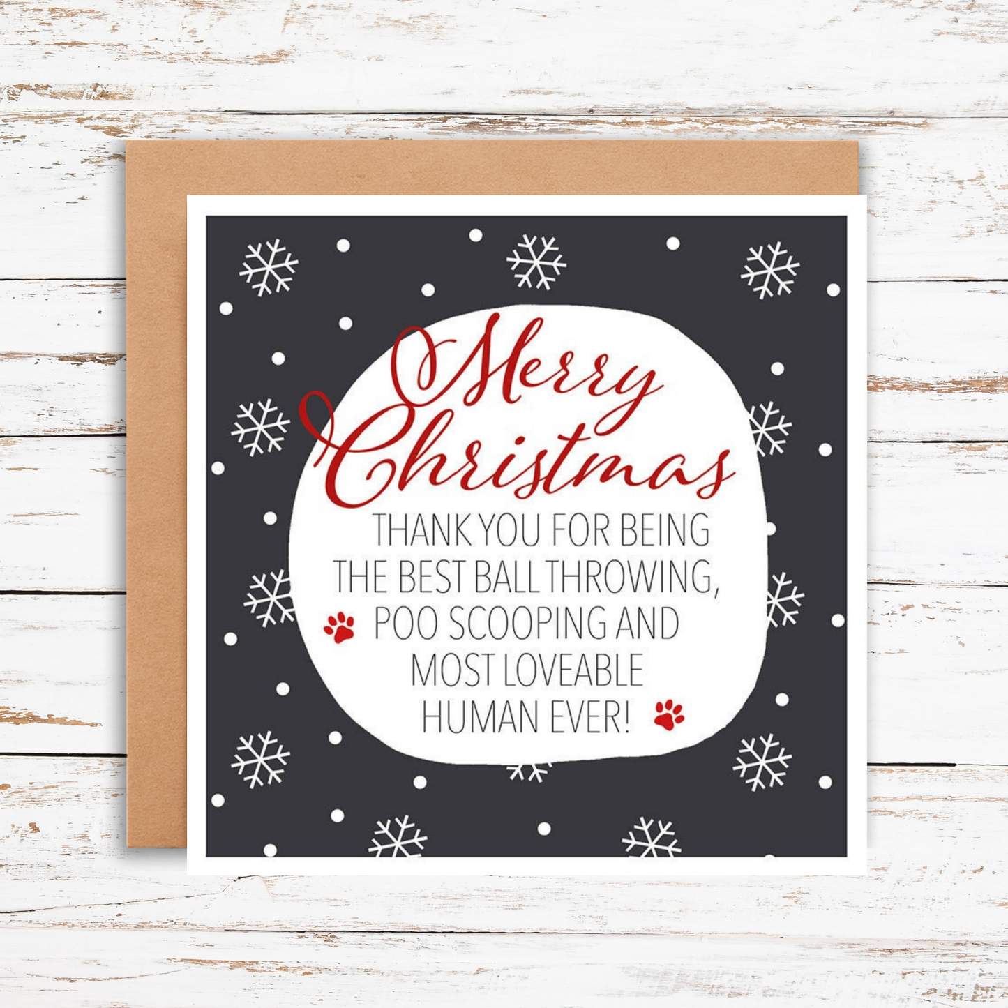 Christmas card with red text on a dark background, featuring snowflakes and a kraft envelope.