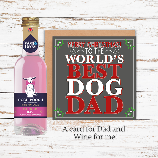 Bottle of Posh Pooch wine with a 'World's Best Dog Dad' card on a wooden surface