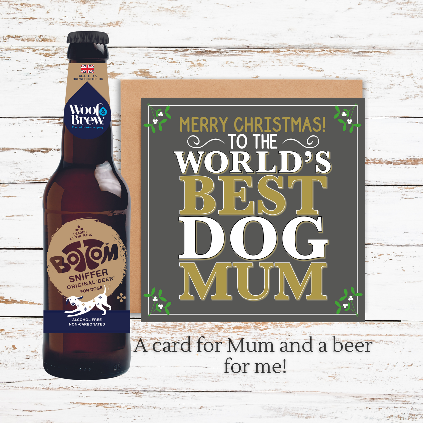 Beer bottle and Christmas card on a wooden surface