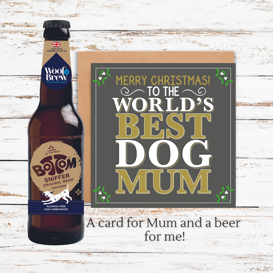 Beer bottle and Christmas card on a wooden surface