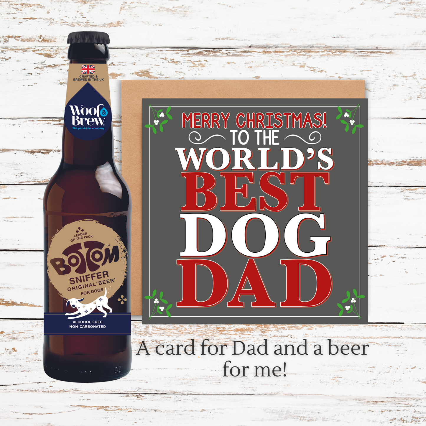 Beer bottle and Christmas card for 'World's Best Dog Dad' on a wooden surface