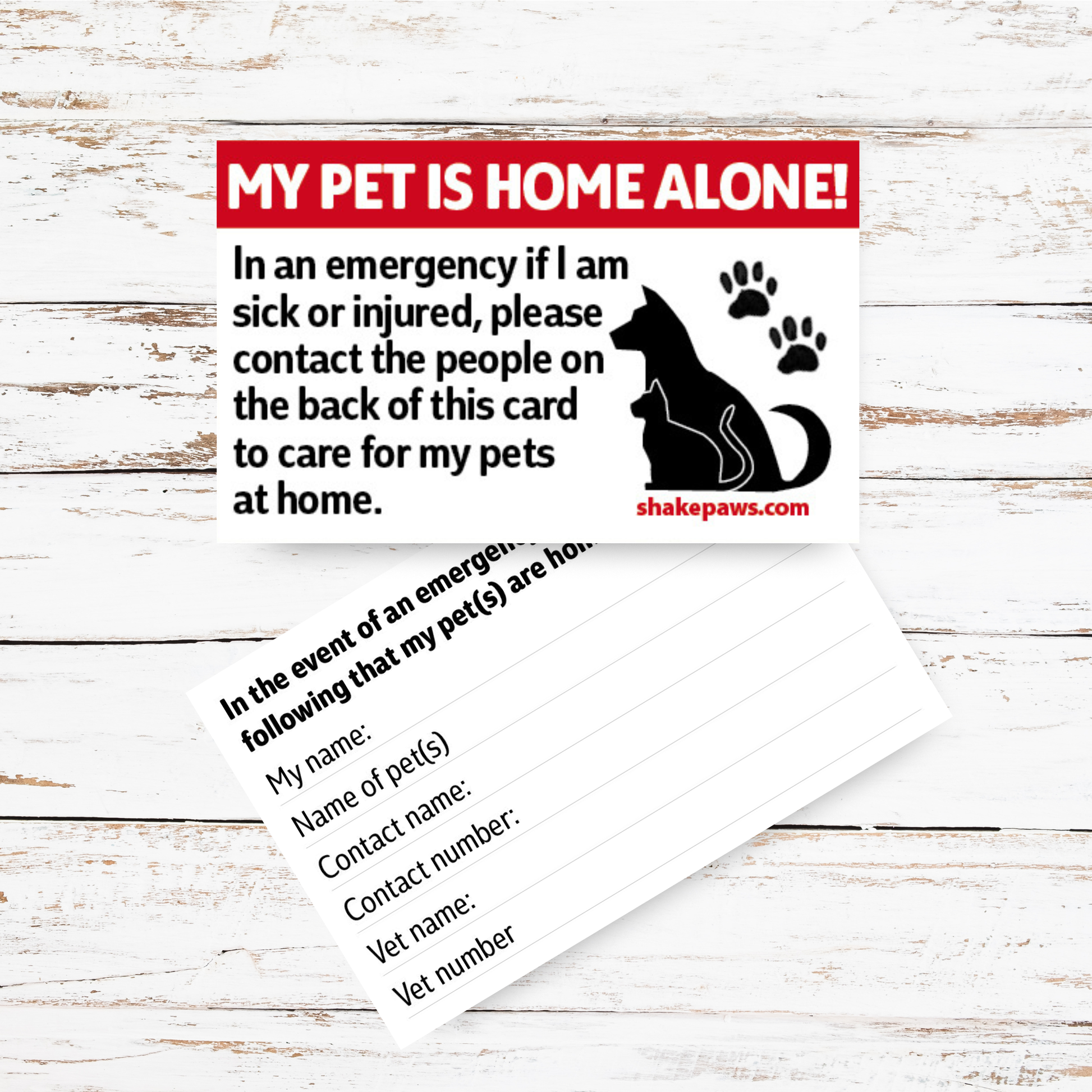 Pet safety information card with a red border and black text on a wooden surface
